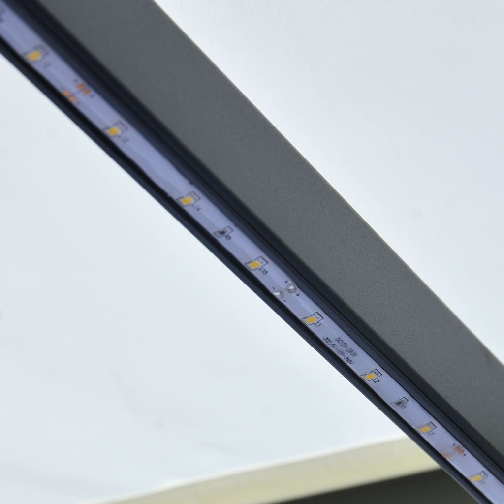 vidaXL Käsin sisäänkelattava markiisi LEDillä 600x300 cm kerma